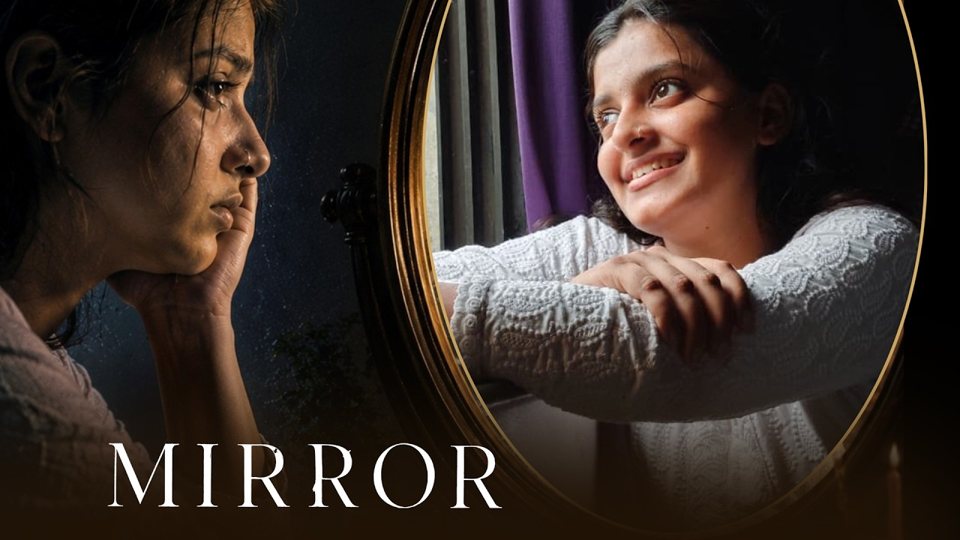 Darpan: a woman looks sadly at a mirror that shows her smiling